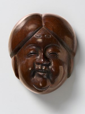 Lot 148 - A JAPANESE MASK NETSUKE OF A LARGE OKAME