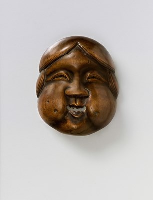 Lot 149 - A JAPANESE MASK NETSUKE OF OKAME