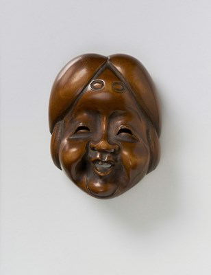 Lot 151 - A JAPANESE MASK NETSUKE OF OKAME