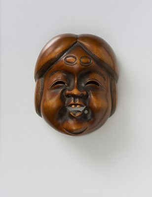 Lot 152 - A JAPANESE MASK NETSUKE OF OKAME