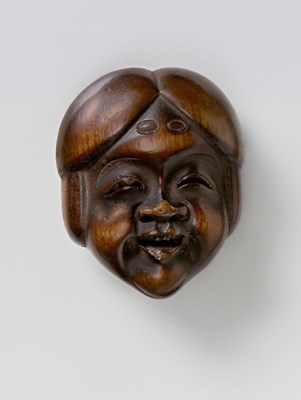 Lot 153 - A JAPANESE MASK NETSUKE OF OKAME