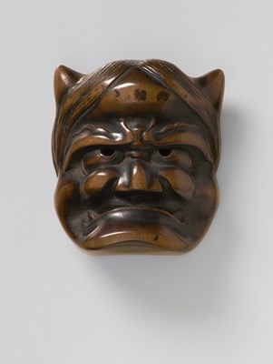 Lot 160 - A JAPANESE MASK NETSUKE OF ONI