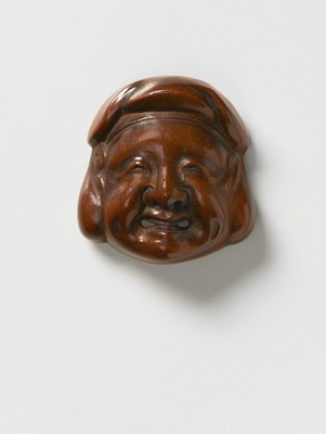 Lot 181 - A JAPANESE MASK NETSUKE OF DAIKOKU