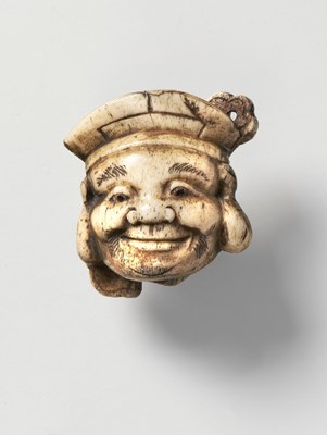 Lot 185 - A JAPANESE MASK NETSUKE OF DAIKOKU