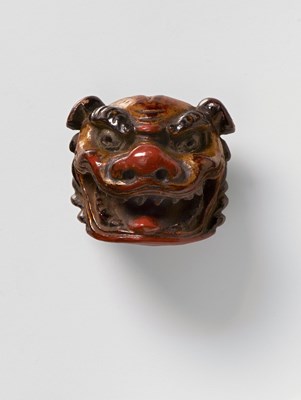Lot 187 - A JAPANESE MASK NETSUKE OF SHISHI