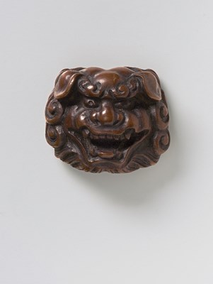 Lot 188 - A JAPANESE MASK NETSUKE OF SHISHI