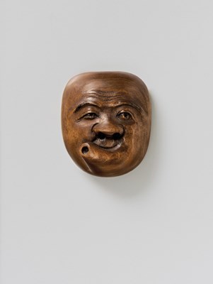 Lot 193 - A JAPANESE MASK NETSUKE OF USOBUKI
