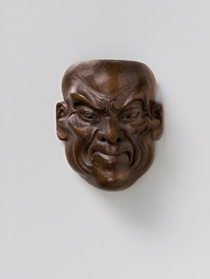 Lot 207 - A JAPANESE MASK NETSUKE OF A GRINNING MAN