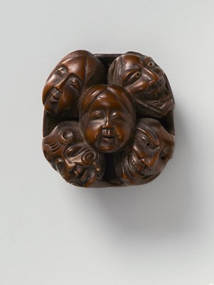 Lot 212 - A JAPANESE NETSUKE OF A CLUSTER OF NOH AND KYOGEN MASKS