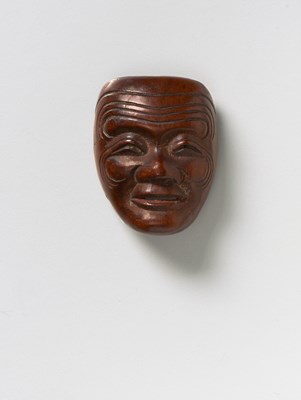 Lot 214 - A JAPANESE MASK NETSUKE OF A MALE MASK