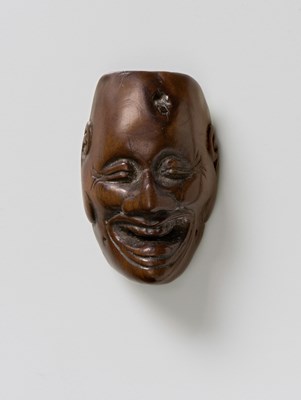 Lot 215 - A JAPANESE MASK NETSUKE OF A LAUGHING DEMON