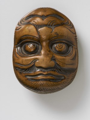 Lot 224 - A JAPANESE MASK NETSUKE OF A LARGE REVERSIBLE MASK OF HIRSUTE MEN