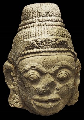Lot 301 - A MONUMENTAL CHAM STONE HEAD OF A DVARAPALA