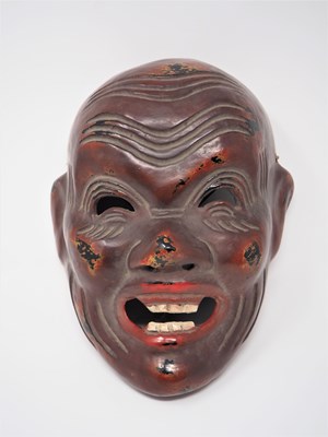 Lot 392 - A JAPANESE MASK AND THREE JAVANESE KRIS HOLDERS