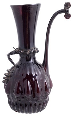 Lot 410 - â€¡ A ZAND AUBERGINE GLASS EWER