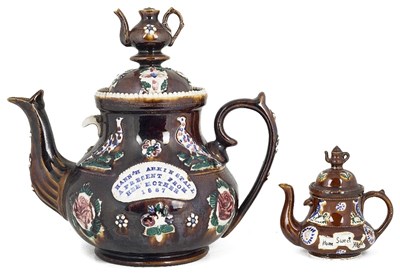 Lot 464 - A MEASHAM POTTERY 'BARGE WARE' TEAPOT