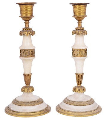 Lot 495 - A PAIR OF WHITE MARBLE AND ORMOLU CANDLESTICKS
