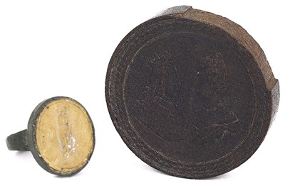 Lot 502 - A RELIEF IMPRESSED AND TURNED WOOD GAMING COUNTER