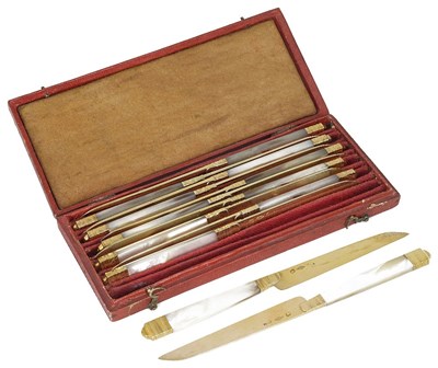 Lot 542 - A SET OF TWELVE FRENCH SILVER-GILT AND MOTHER-OF-PEARL FRUIT KNIVES