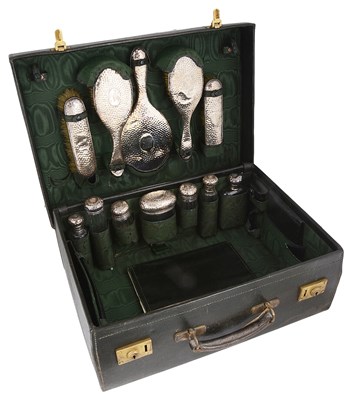 Lot 575 - ~A LEATHER CASED DRESSING TABLE SET