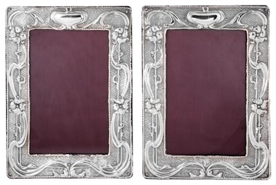 Lot 588 - A PAIR OF EDWARDIAN SILVER-MOUNTED PHOTOGRAPH FRAMES