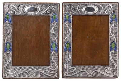 Lot 594 - A PAIR OF EDWARDIAN SILVER-MOUNTED PHOTOGRAPH FRAMES