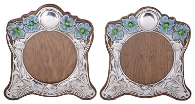 Lot 595 - A PAIR OF EDWARDIAN SILVER-MOUNTED PHOTOGRAPH FRAMES