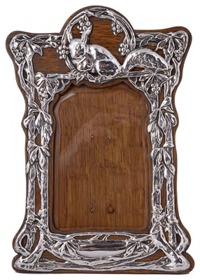 Lot 596 - AN EDWARDIAN SILVER-MOUNTED PHOTOGRAPH FRAME