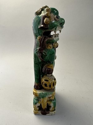 Lot 42 - A PAIR OF CHINESE BISCUIT BUDDHIST LION INCENCE HOLDERS, QING DYNASTY, KANGXI PERIOD (1662-1722)