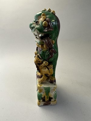 Lot 42 - A PAIR OF CHINESE BISCUIT BUDDHIST LION INCENCE HOLDERS, QING DYNASTY, KANGXI PERIOD (1662-1722)