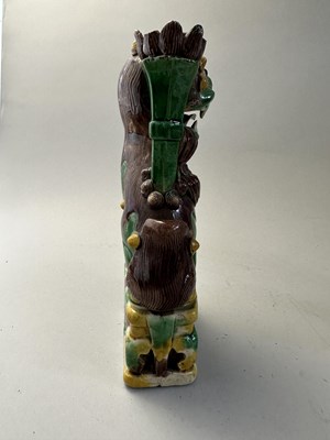 Lot 42 - A PAIR OF CHINESE BISCUIT BUDDHIST LION INCENCE HOLDERS, QING DYNASTY, KANGXI PERIOD (1662-1722)
