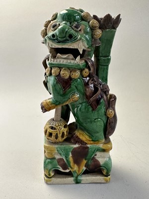 Lot 42 - A PAIR OF CHINESE BISCUIT BUDDHIST LION INCENCE HOLDERS, QING DYNASTY, KANGXI PERIOD (1662-1722)