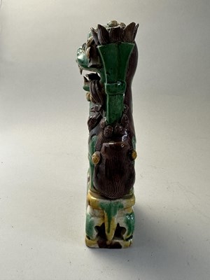 Lot 42 - A PAIR OF CHINESE BISCUIT BUDDHIST LION INCENCE HOLDERS, QING DYNASTY, KANGXI PERIOD (1662-1722)