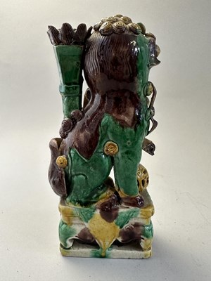 Lot 42 - A PAIR OF CHINESE BISCUIT BUDDHIST LION INCENCE HOLDERS, QING DYNASTY, KANGXI PERIOD (1662-1722)