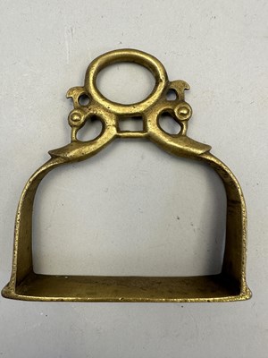 Lot 548 - AN INDIAN COPPER ALLOY STIRRUP AND A PAIR OF INDIAN COPPER ALLOY STIRRUPS, 18TH/19TH CENTURY