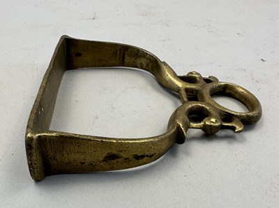 Lot 548 - AN INDIAN COPPER ALLOY STIRRUP AND A PAIR OF INDIAN COPPER ALLOY STIRRUPS, 18TH/19TH CENTURY