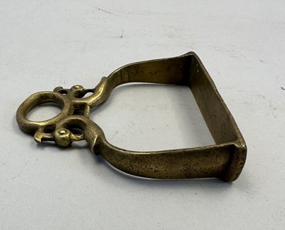 Lot 548 - AN INDIAN COPPER ALLOY STIRRUP AND A PAIR OF INDIAN COPPER ALLOY STIRRUPS, 18TH/19TH CENTURY
