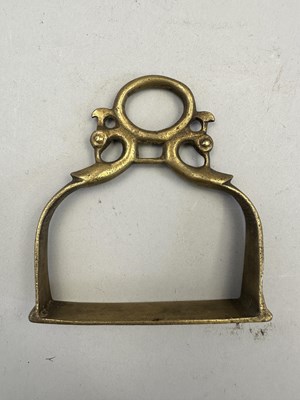 Lot 548 - AN INDIAN COPPER ALLOY STIRRUP AND A PAIR OF INDIAN COPPER ALLOY STIRRUPS, 18TH/19TH CENTURY