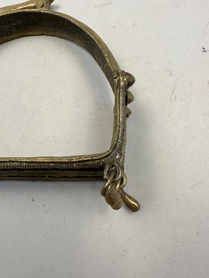Lot 548 - AN INDIAN COPPER ALLOY STIRRUP AND A PAIR OF INDIAN COPPER ALLOY STIRRUPS, 18TH/19TH CENTURY