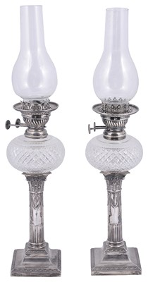 Lot 611 - A PAIR OF VICTORIAN SILVER CANDLESTICK OIL LAMPS