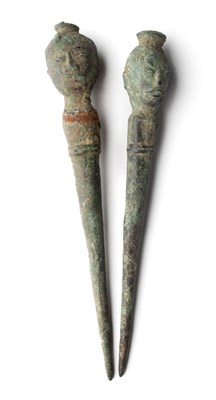 Lot 253 - TWO BRONZE HAIRPINS