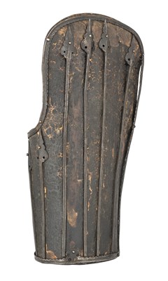 Lot 128 - A RARE IRON-MOUNTED LACQUERED LEATHER FOREARM DEFENCE, PROBABLY TIBET 15TH/16TH CENTURY