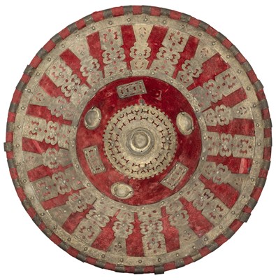 Lot 201 - AN EAST AFRICAN GILT-METAL MOUNTED HIDE SHIELD, LATE 19TH/20TH CENTURY