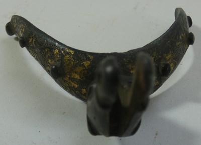 Lot 394 - A NORTH EUROPEAN GILT-BRONZE SPUR, SECOND QUARTER OF THE 17TH CENTURY AND A QUANTITY OF BUCKLES