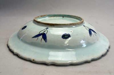 Lot 36 - AN IZNIK DISH, OTTOMAN ANATOLIA, CIRCA 1590-1600