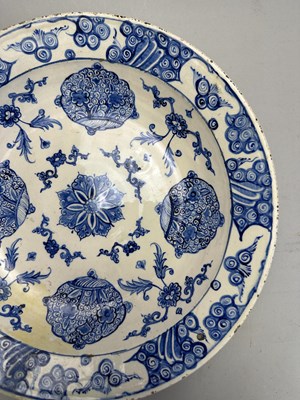 Lot 32 - AN IZNIK BLUE AND WHITE DISH, OTTOMAN ANATOLIA, CIRCA 1560-80