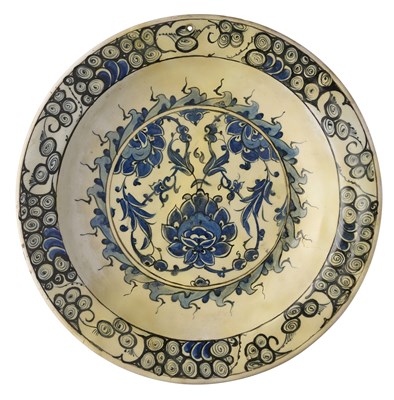 Lot 26 - AN IZNIK BLUE AND WHITE DISH,  OTTOMAN ANATOLIA, CIRCA 1600