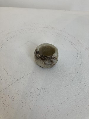 Lot 85 - A GROUP OF FOUR CHINESE CARVED JADE ARCHERS RINGS, QING DYNASTY, 19TH CENTURY