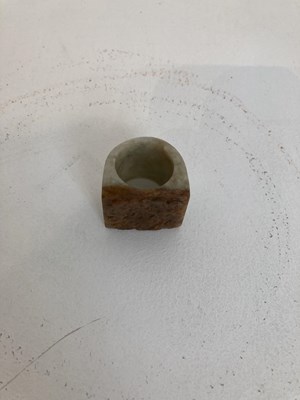 Lot 86 - A GROUP OF THREE CHINESE CARVED JADE ARCHERS RINGS, QING DYNASTY
