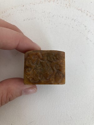 Lot 86 - A GROUP OF THREE CHINESE CARVED JADE ARCHERS RINGS, QING DYNASTY